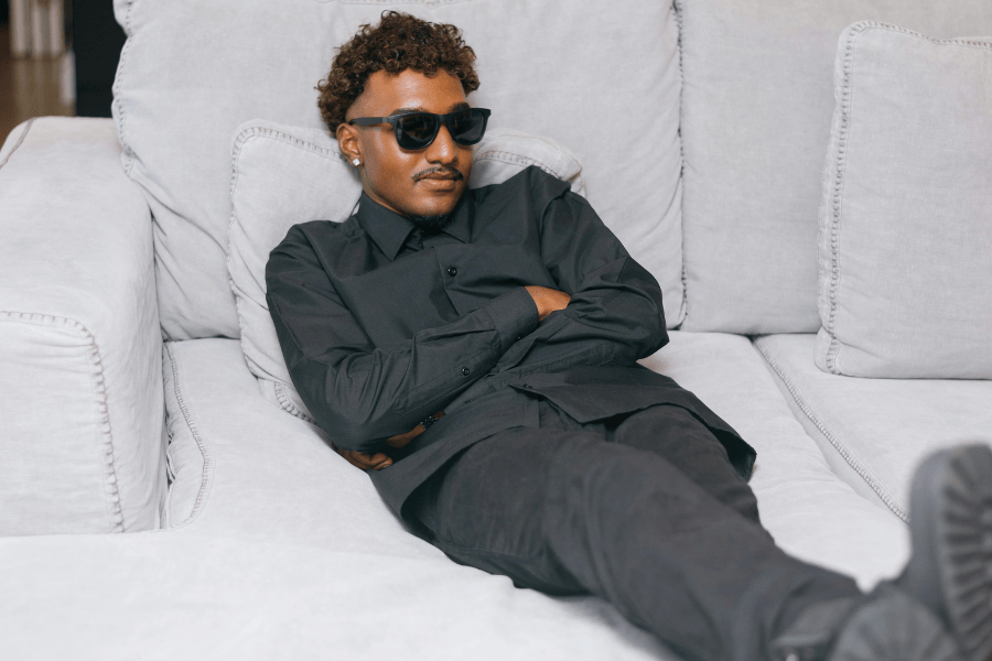 a guy on a white couch