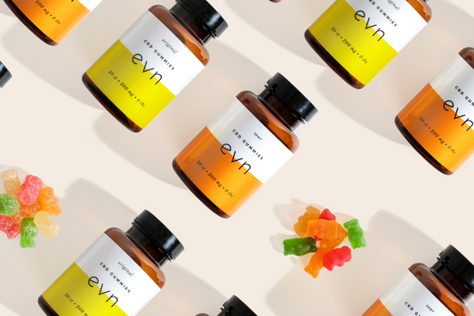 cbd gummy bottles with gummies stacked together