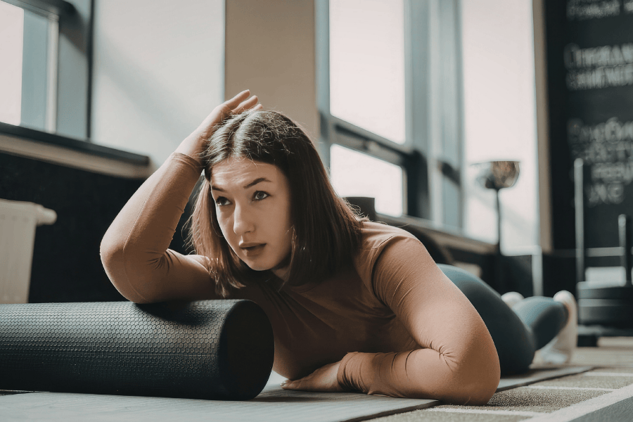 a girl foam rolling