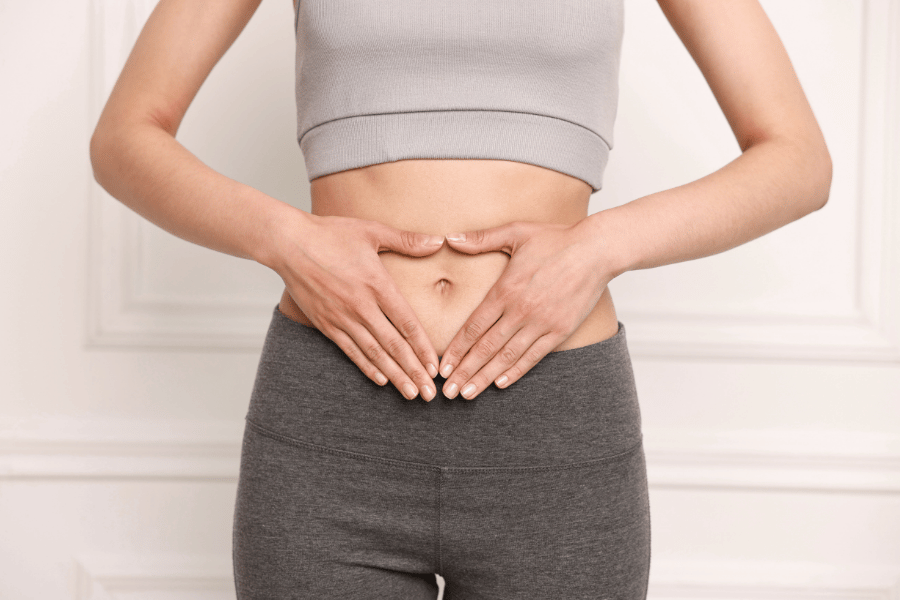 a woman touching her abdomen