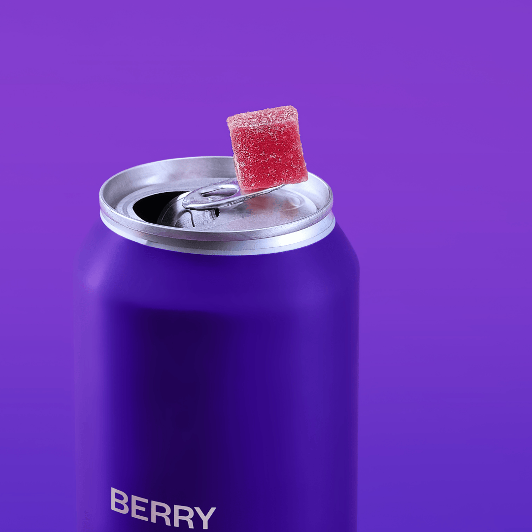 a berry gummy on top of a can