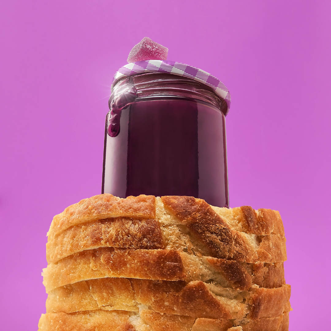 bread and jelly with a grape gummy on top