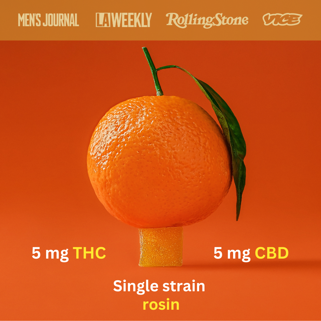 an orange on top of an orange gummy