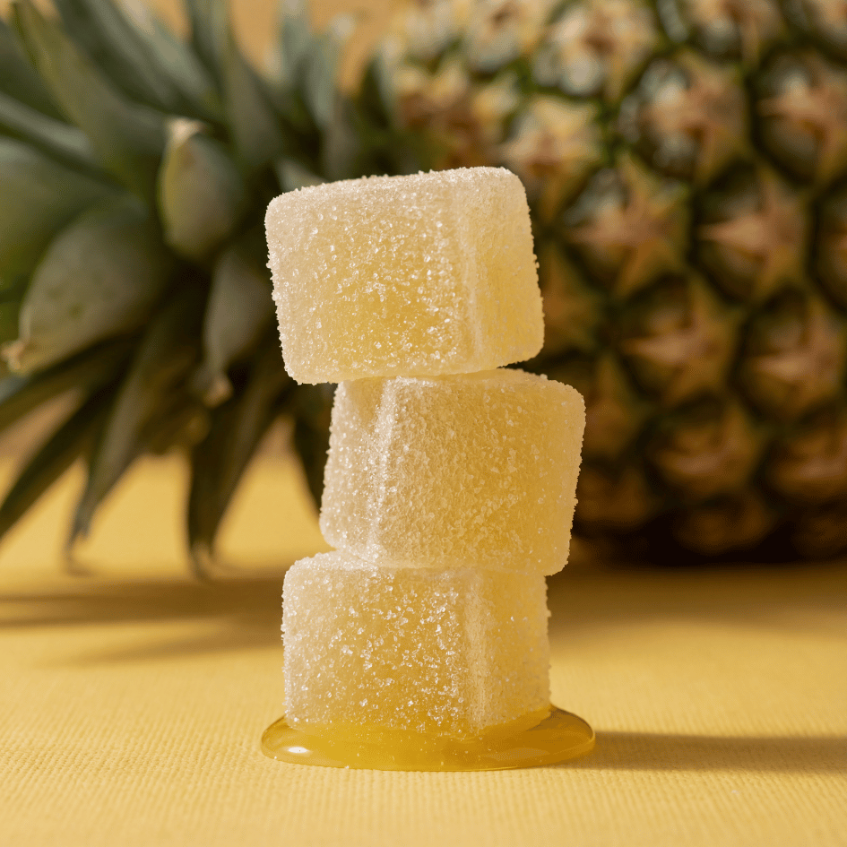 pineapple gummies stacked on top of one another