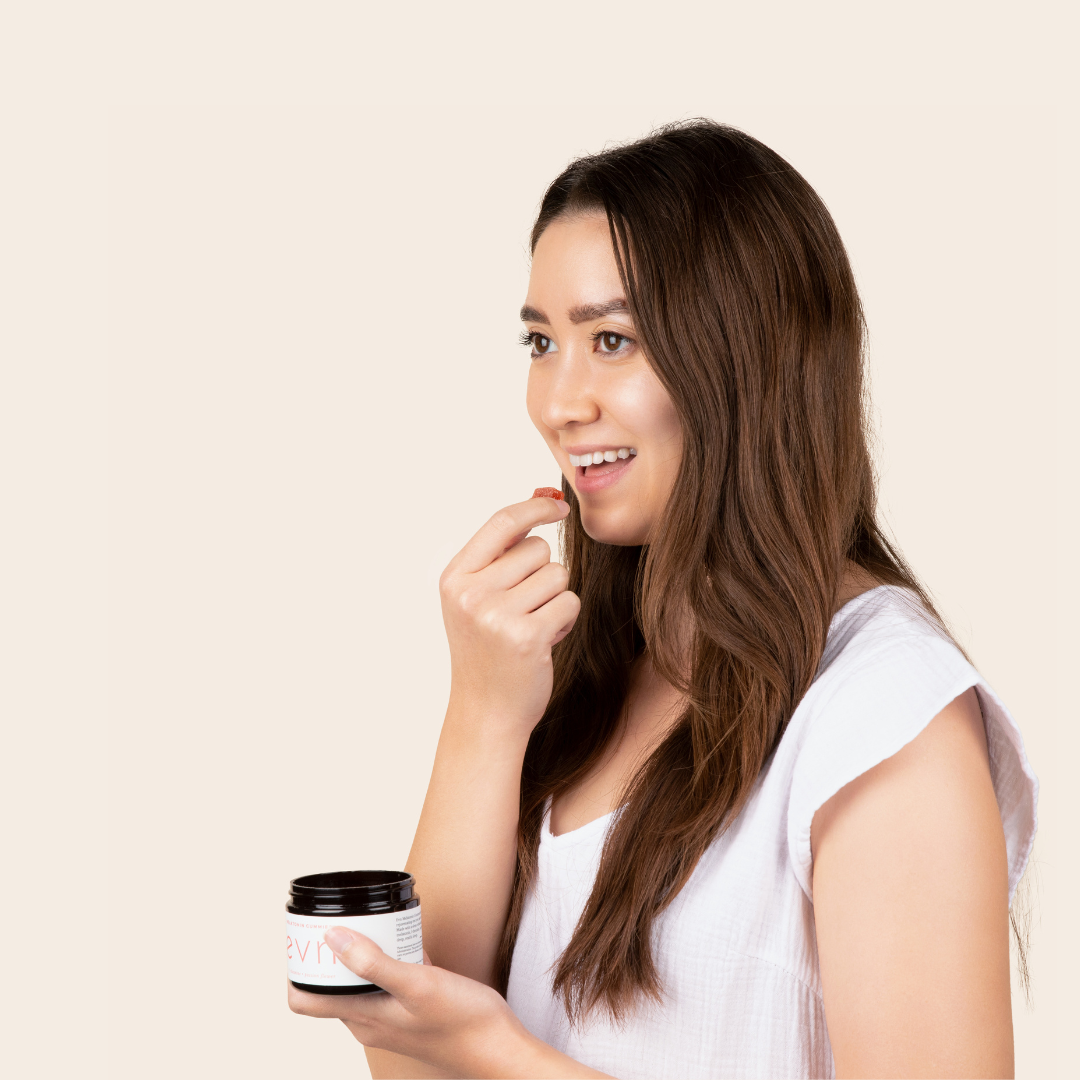 girl holding evn melatonin gummies