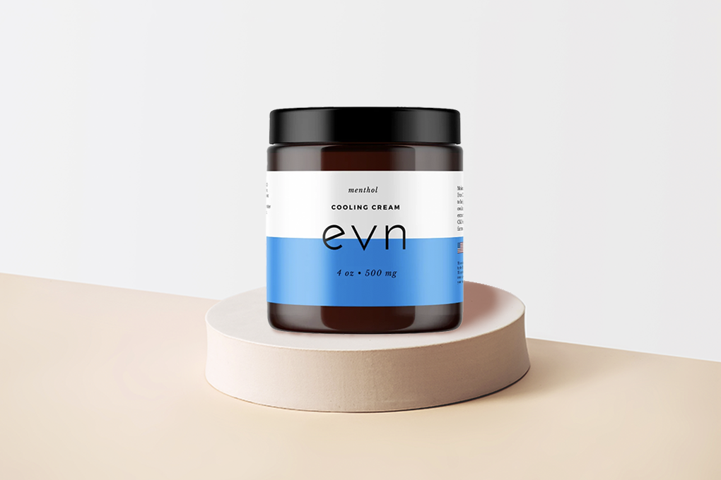 Closed jar of Evn CBD Cream with Menthol on a wooden podium.