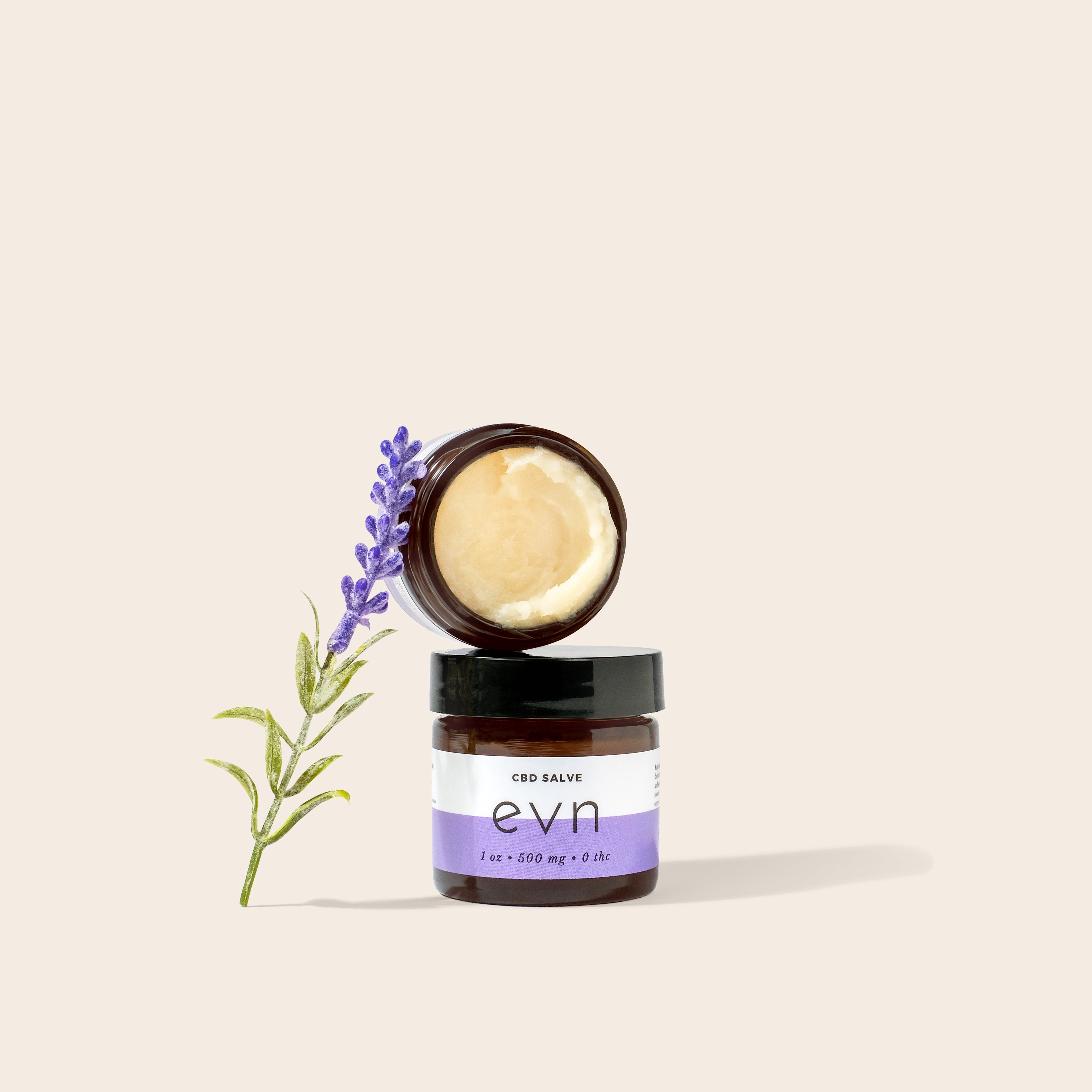 Evn CBD Salve with fresh lavender leaning against jar