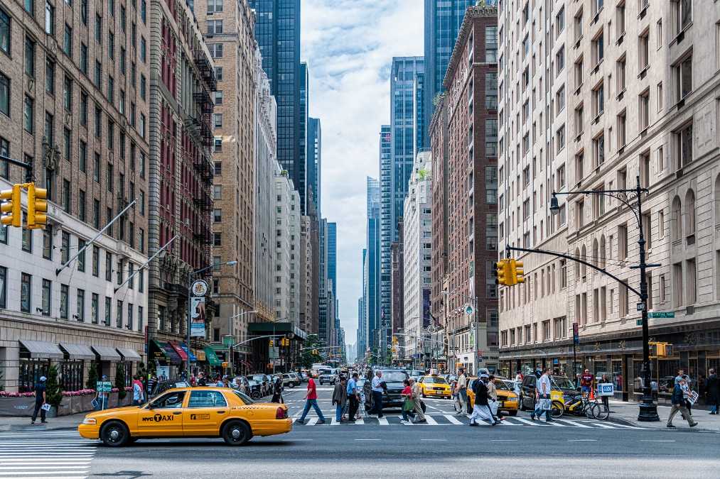 cab drives across a new york city street