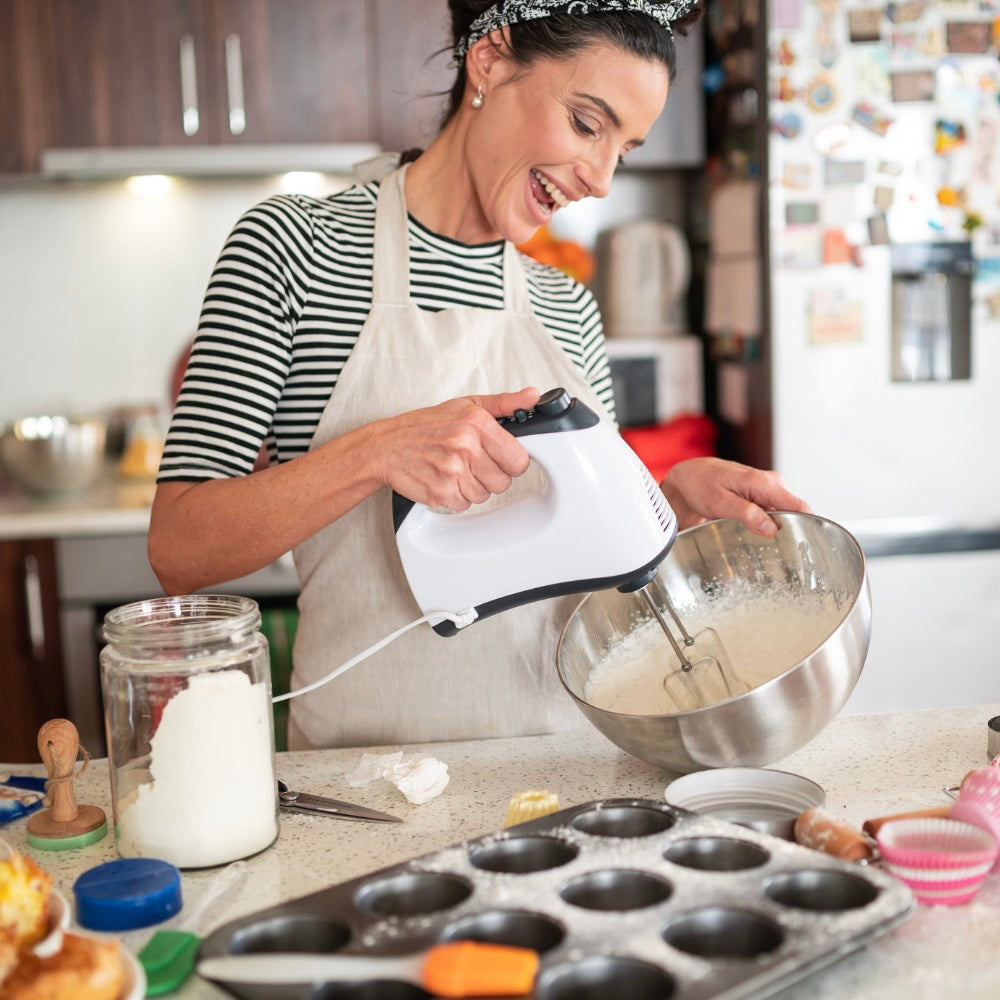 woman-holding-whisk-to-bake