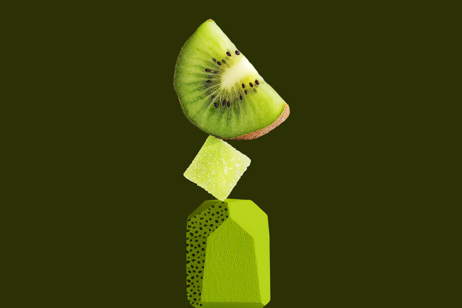 a kiwi stacked on top of an edible gummy