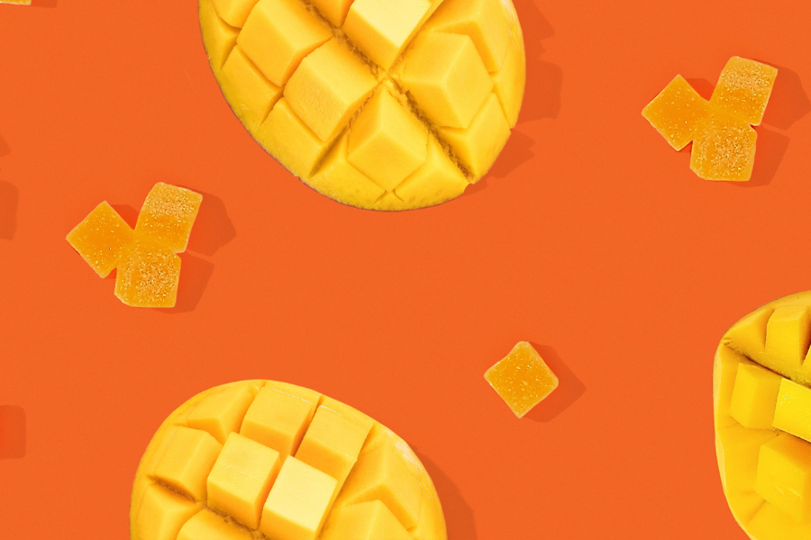 gummies next to sliced mango