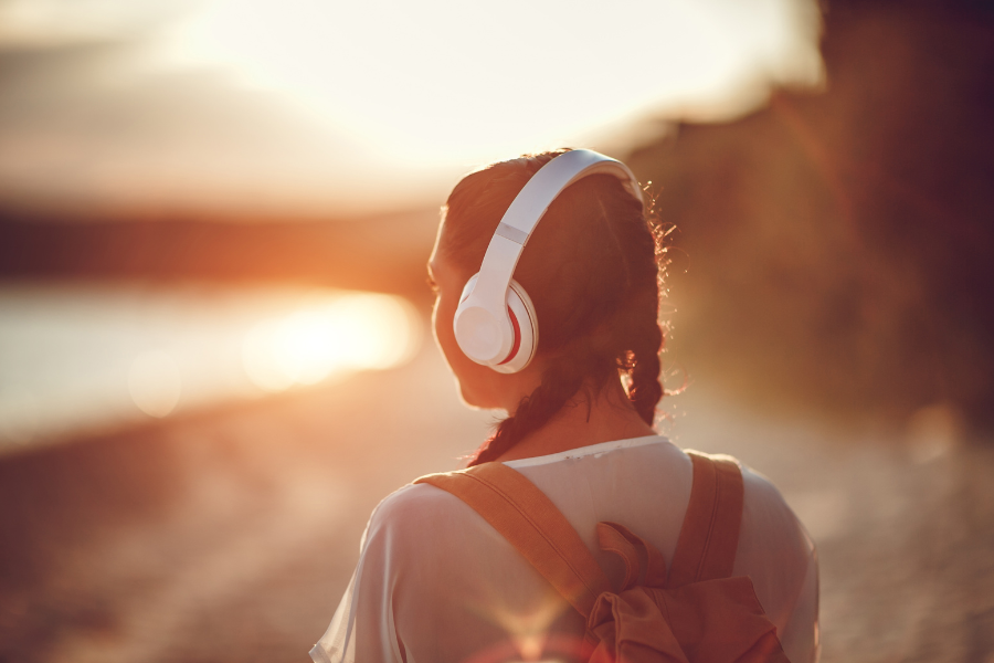 girl listening to music on her headphones