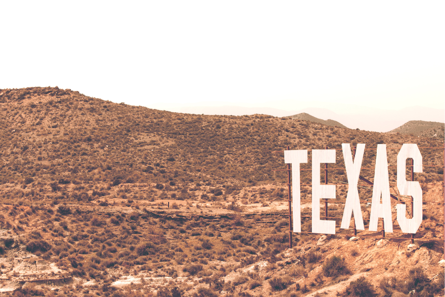 dry desert with a texas sign 
