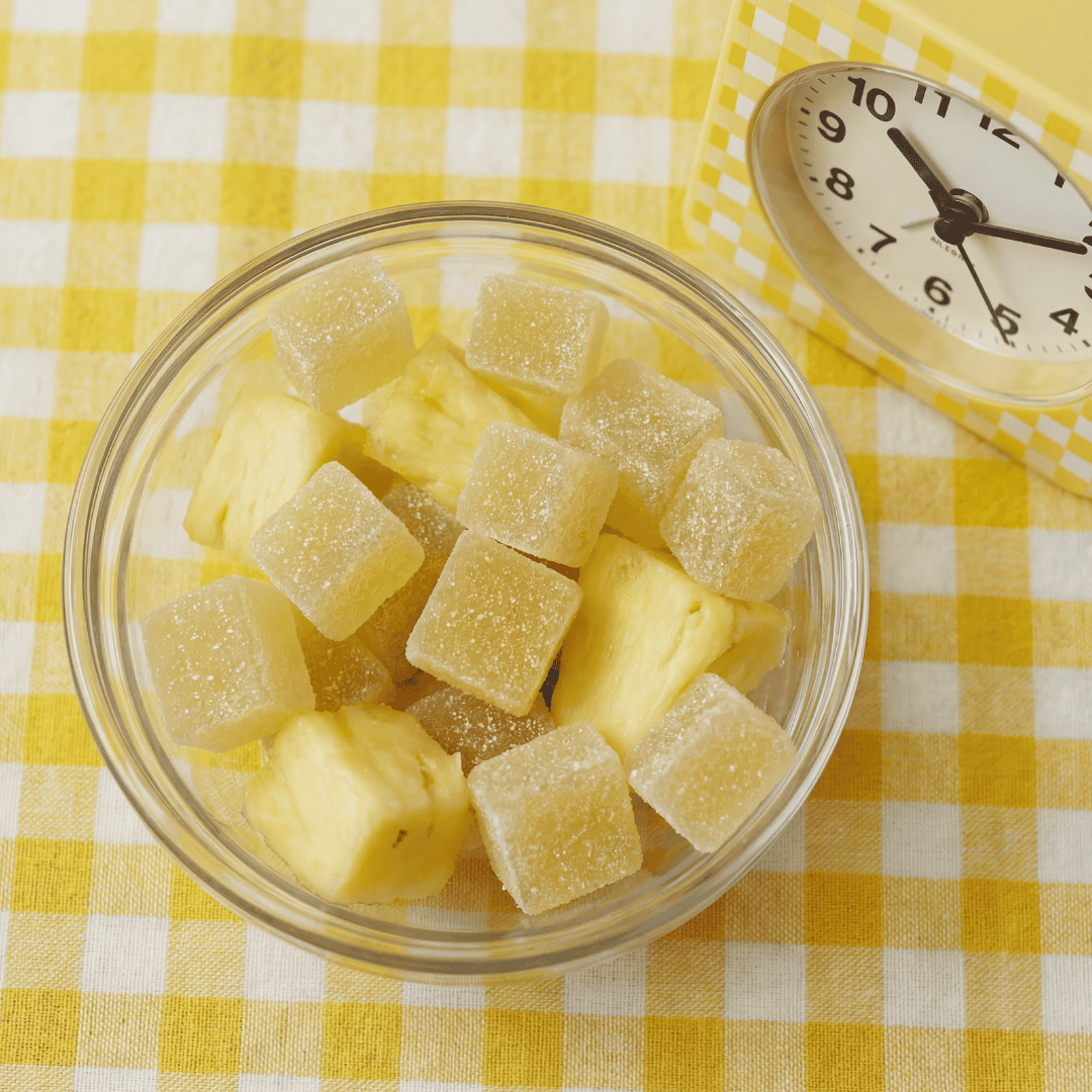 pineapple chunks and gummies in a bowl